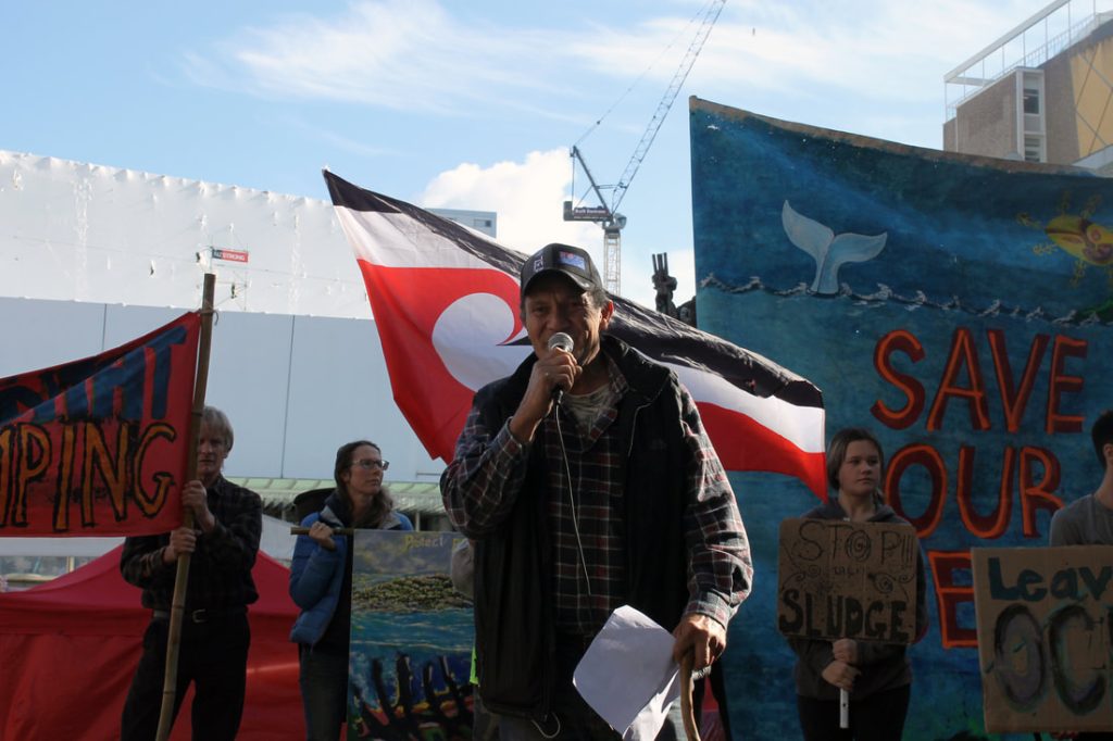 Ngāti Rehua Kaumātua, Opo Ngawaka, addresses the protest crowd.